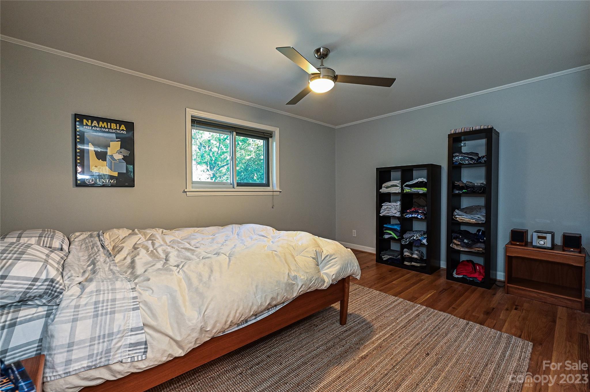 400 Queens Road, Unit B5 Charlotte, NC 28207 - Photo 15 of 20 a bedroom with bed and a book shelf