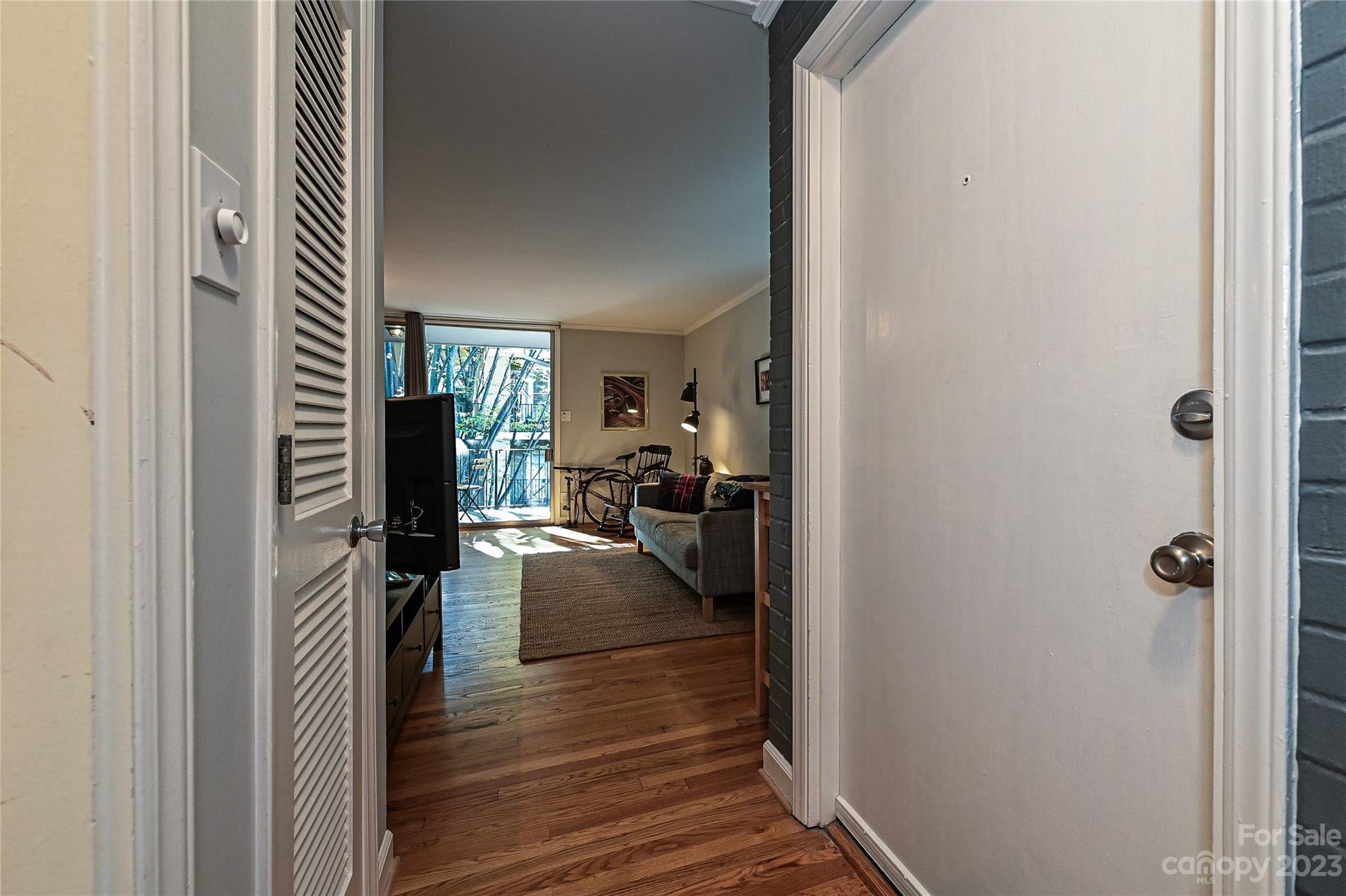 400 Queens Road, Unit B5 Charlotte, NC 28207 - Photo 20 of 20 a view of a hallway and a livingroom with furniture