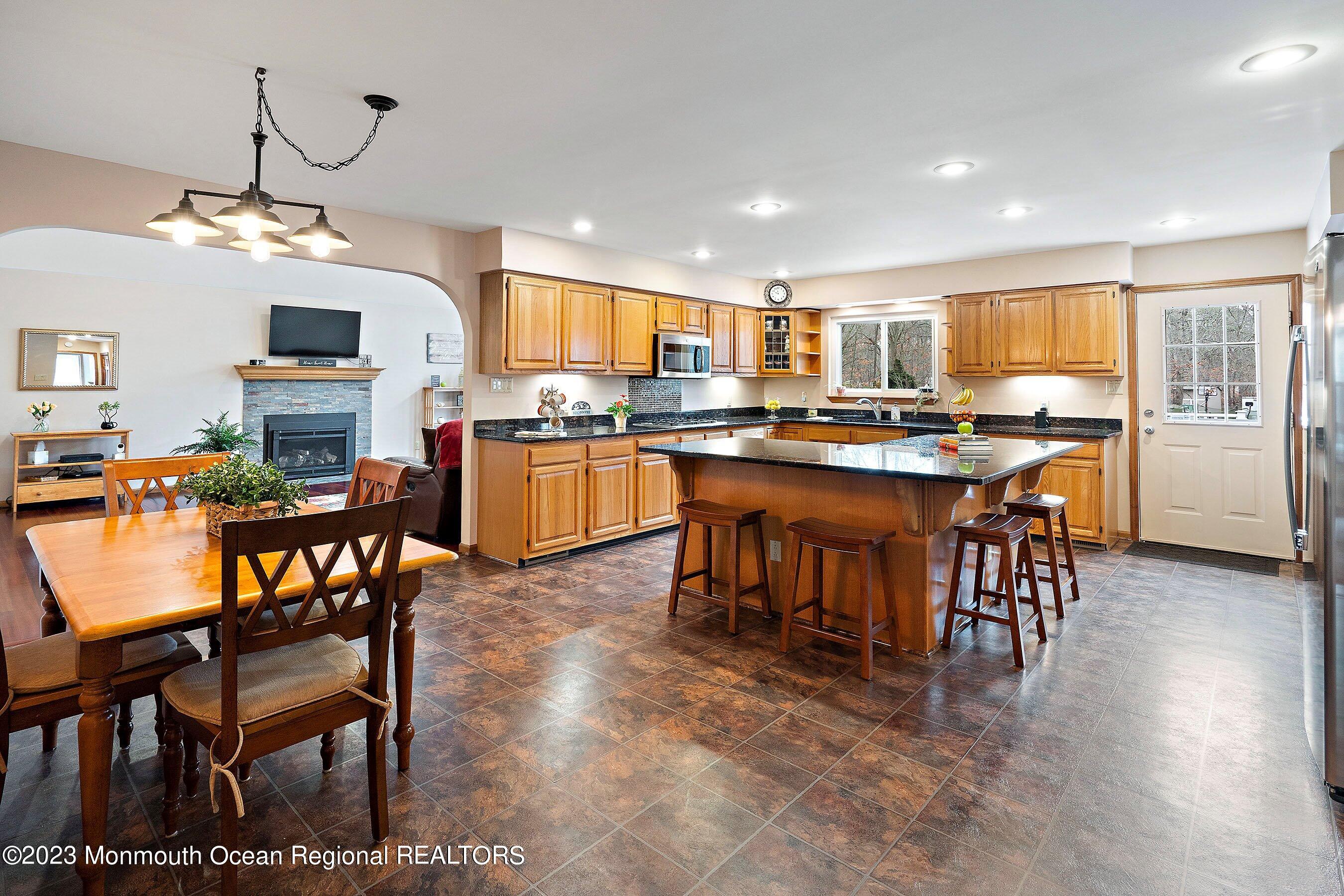 310 Easy Street Howell, NJ 07731 - Photo 11 of 45 a view of a dining room with furniture window and wooden floor