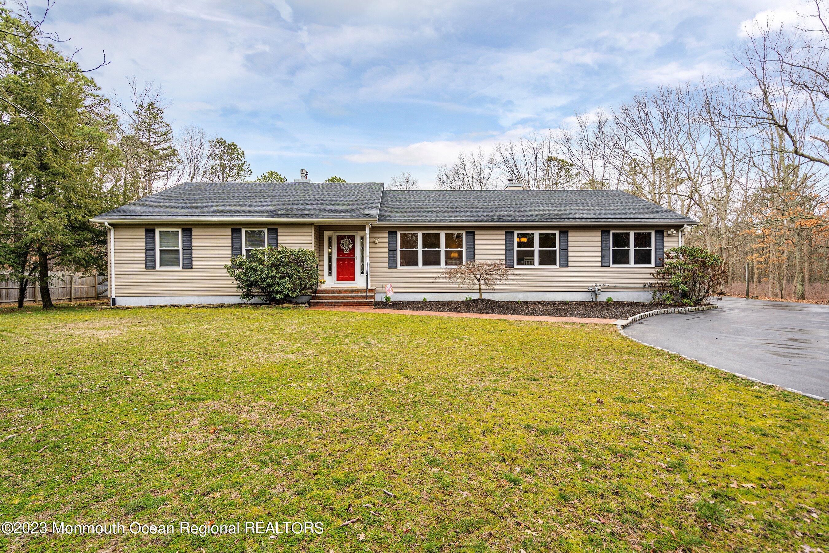 310 Easy Street Howell, NJ 07731 - Photo 2 of 45 a front view of house with yard and outdoor seating