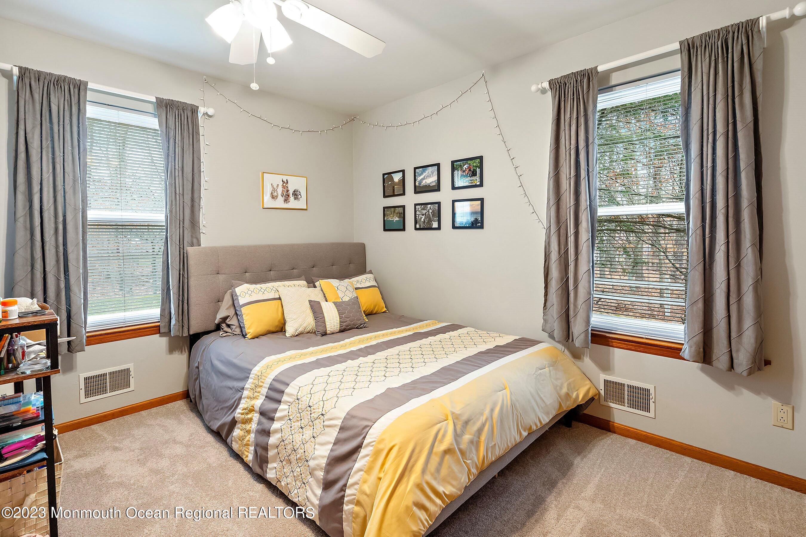 310 Easy Street Howell, NJ 07731 - Photo 22 of 45 a bedroom with a bed and a large window