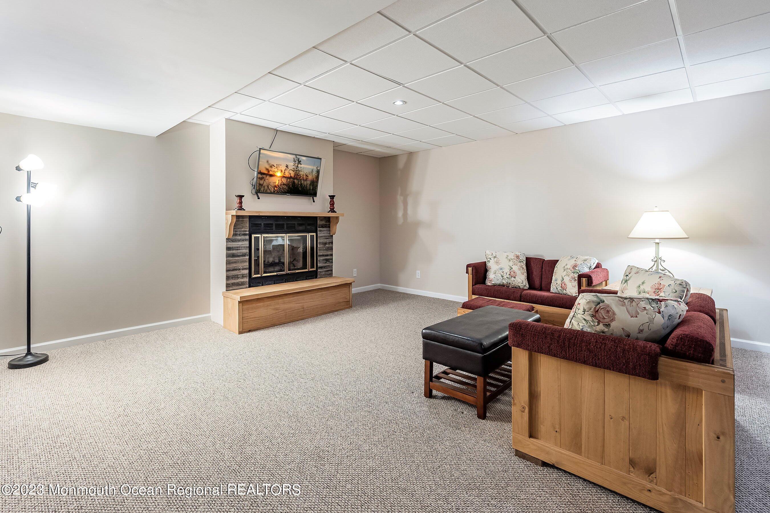 310 Easy Street Howell, NJ 07731 - Photo 29 of 45 a living room with furniture and a wall painting