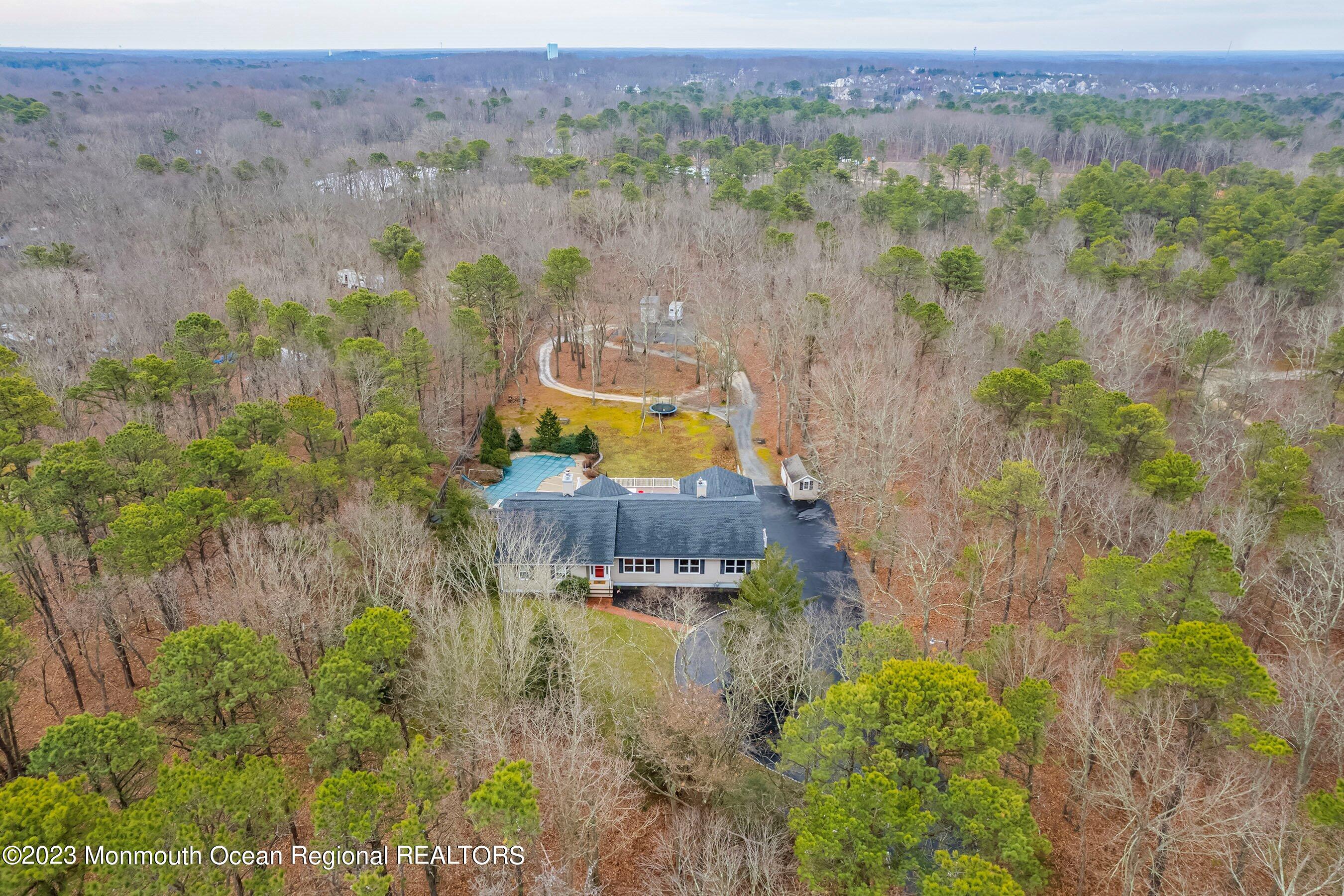310 Easy Street Howell, NJ 07731 - Photo 3 of 45 an aerial view of a house with a lake view