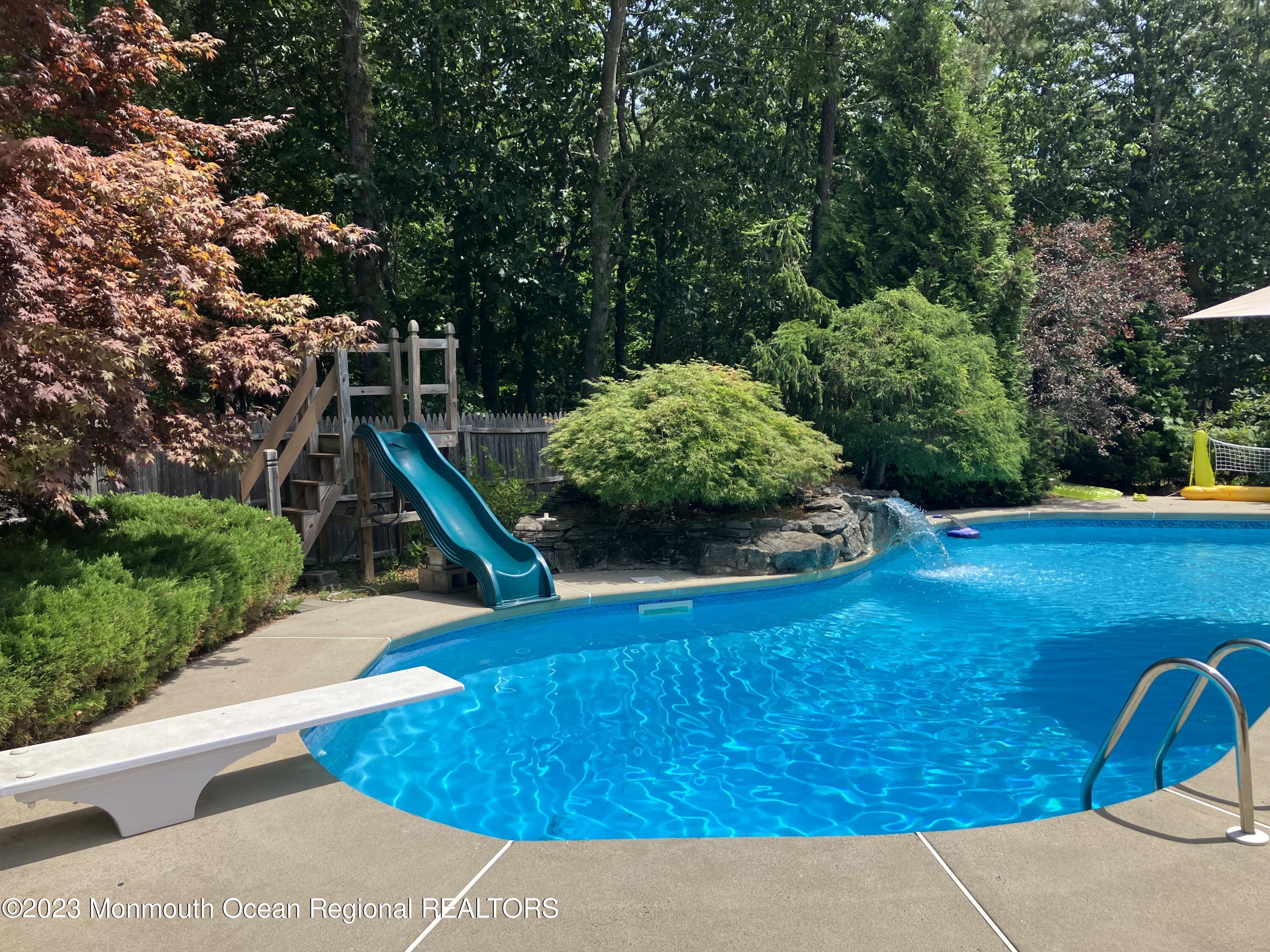310 Easy Street Howell, NJ 07731 - Photo 32 of 45 a view of a backyard with plants and outdoor seating