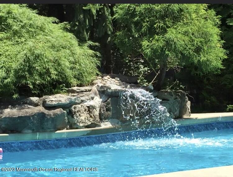310 Easy Street Howell, NJ 07731 - Photo 34 of 45 WATERFALL IN POOL