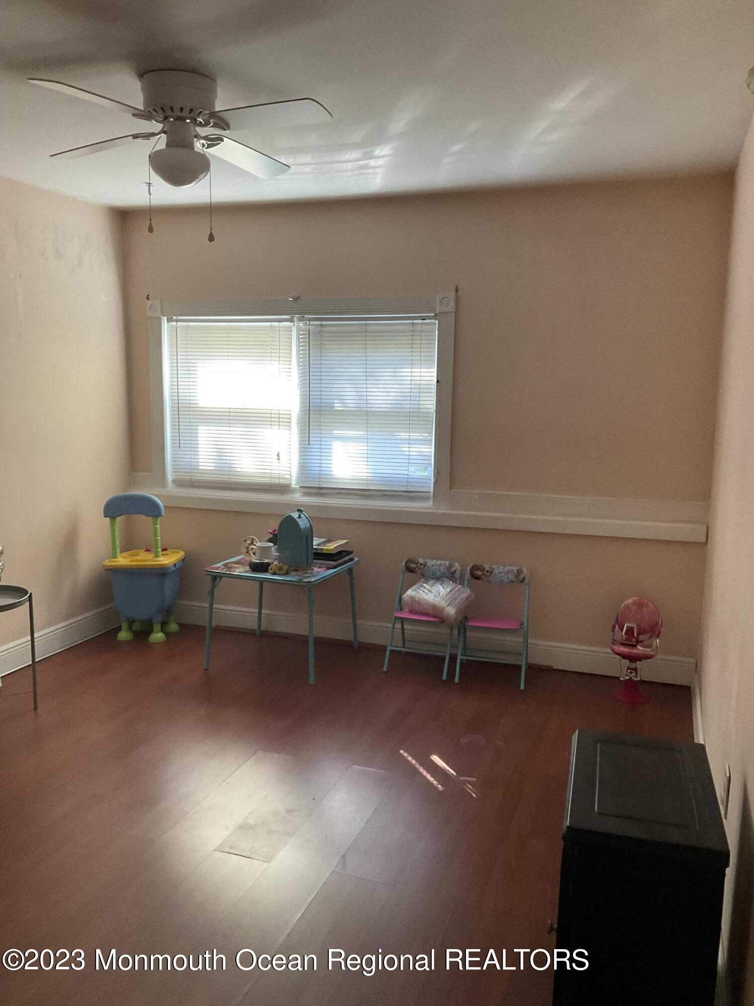 274 Ford Road Howell, NJ 07731 - Photo 12 of 16 a living room with furniture a window and a piano