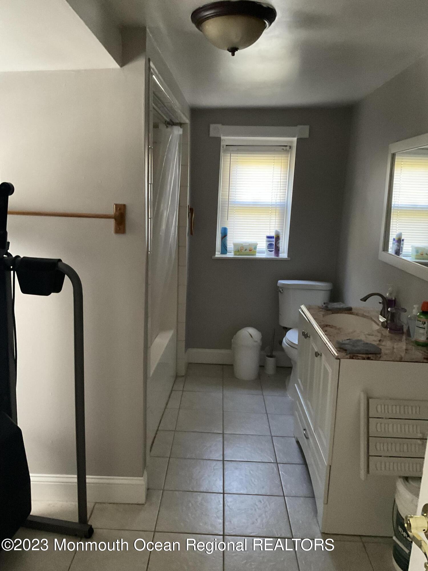 274 Ford Road Howell, NJ 07731 - Photo 13 of 16 a bathroom with a granite countertop sink a toilet and a mirror