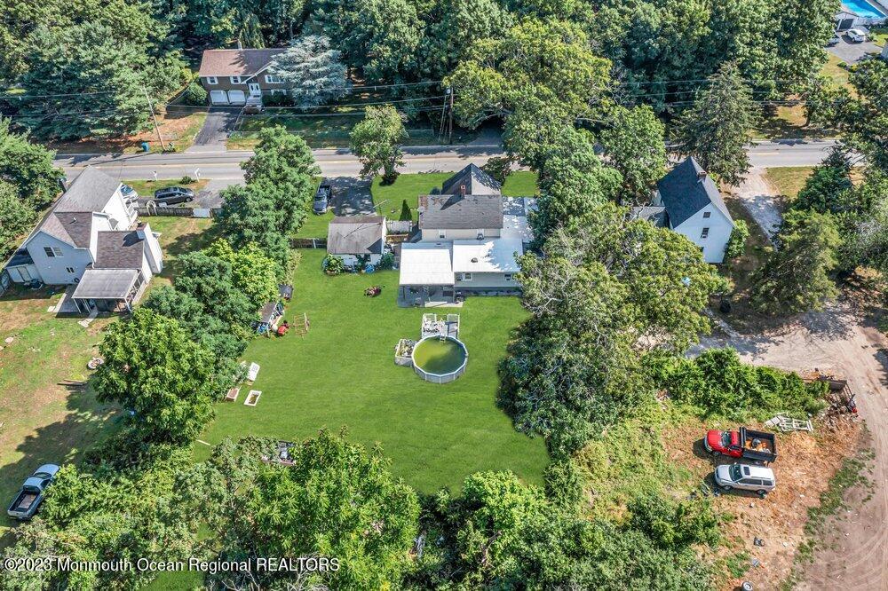 274 Ford Road Howell, NJ 07731 - Photo 3 of 16 an aerial view of a house with outdoor space pool seating area and yard