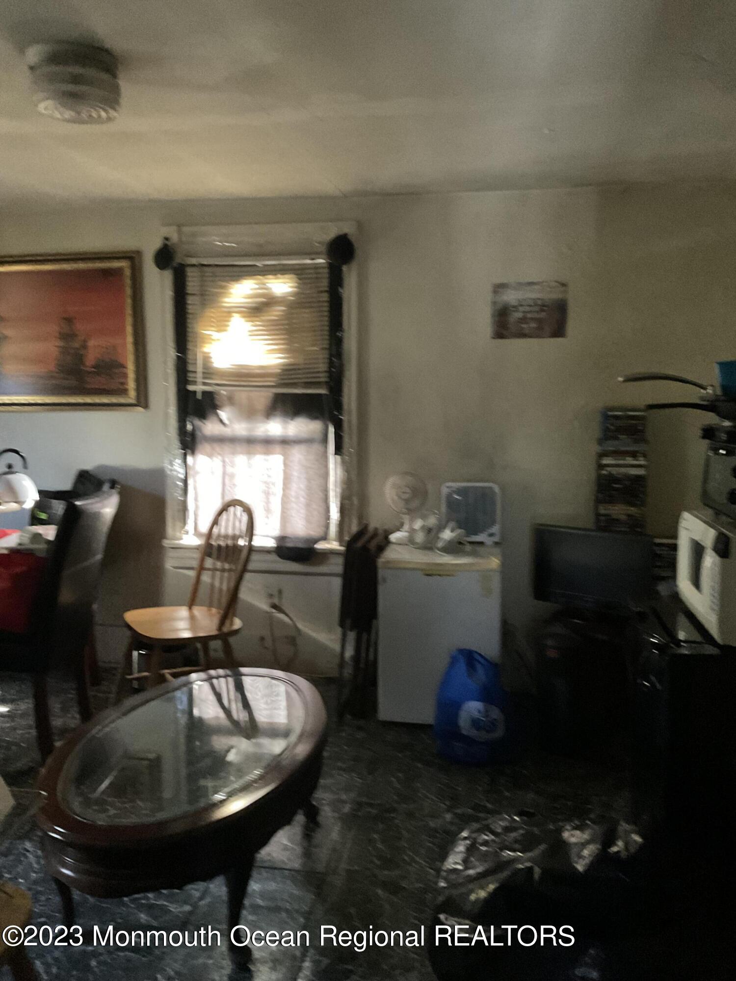 274 Ford Road Howell, NJ 07731 - Photo 6 of 16 a room with table and couch