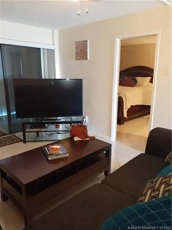 a room with furniture and a flat screen tv