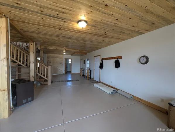 a view of a hallway with stairs