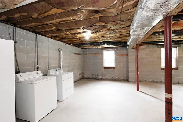 a view of a two chairs in the garden