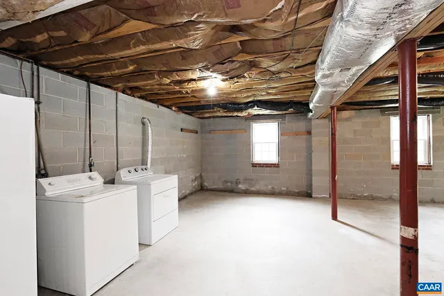 a view of a two chairs in the garden