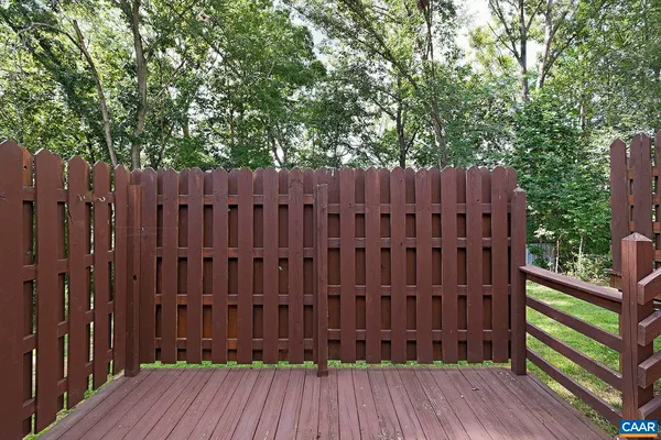 a view of a patio with table and chairs and potted plants