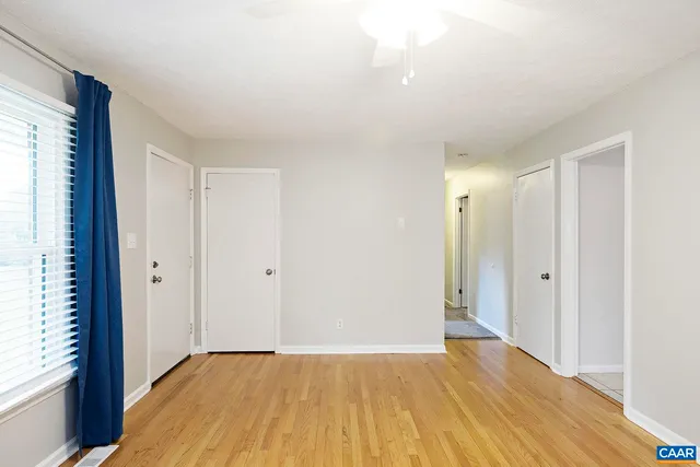 a view of an empty room and window