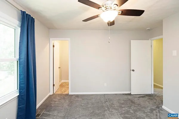 a view of an empty room and window