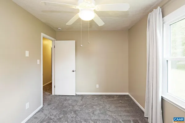 a view of an empty room with a window