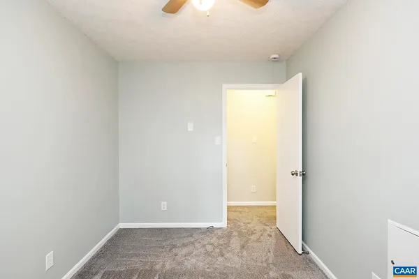 a bathroom with a sink toilet vanity and shower