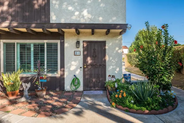 a front view of a house with garden