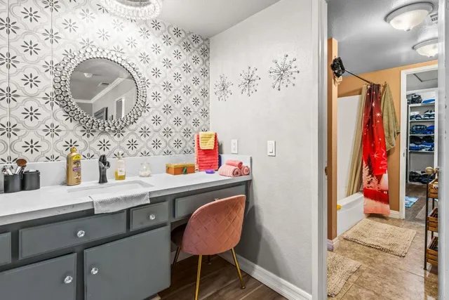 a bathroom with a sink and a mirror