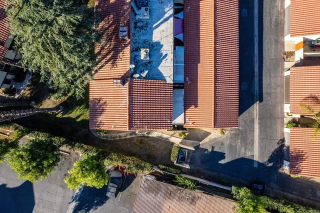 a view of a house with a yard and a garden