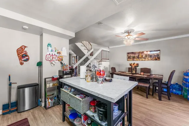 a view of a dining room with furniture and wooden floor