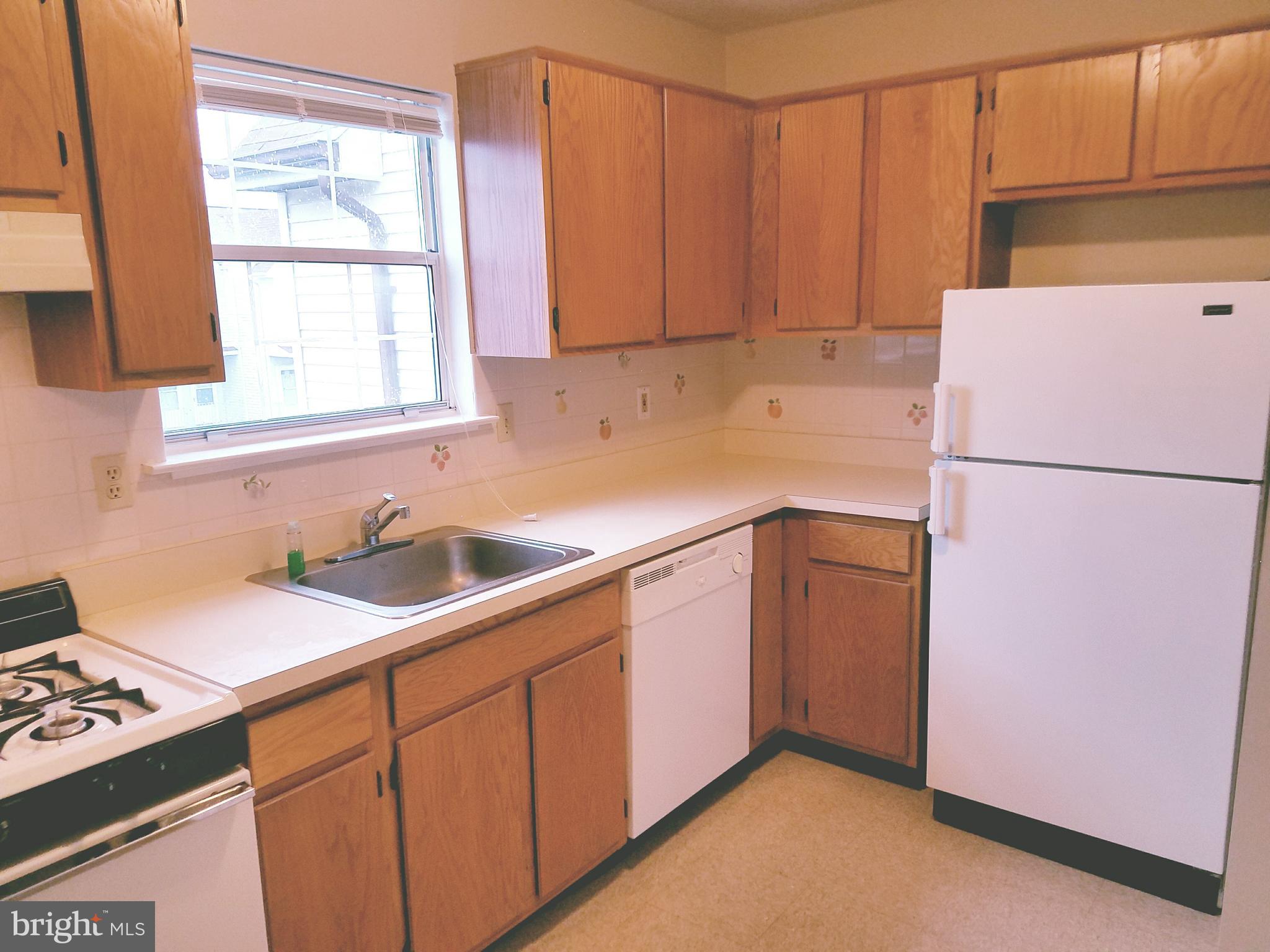 709 Woodchip Road Lumberton, NJ 08048 - Photo 8 of 15 a kitchen with a sink cabinets and a refrigerator