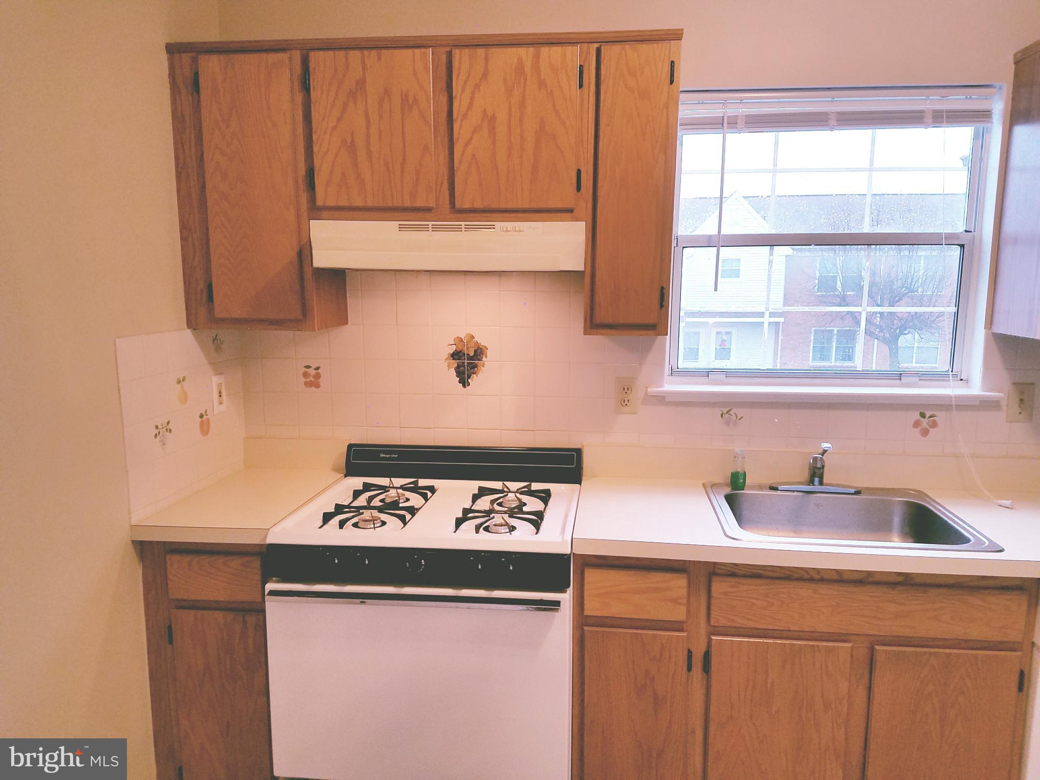 709 Woodchip Road Lumberton, NJ 08048 - Photo 9 of 15 a kitchen with a sink and cabinets