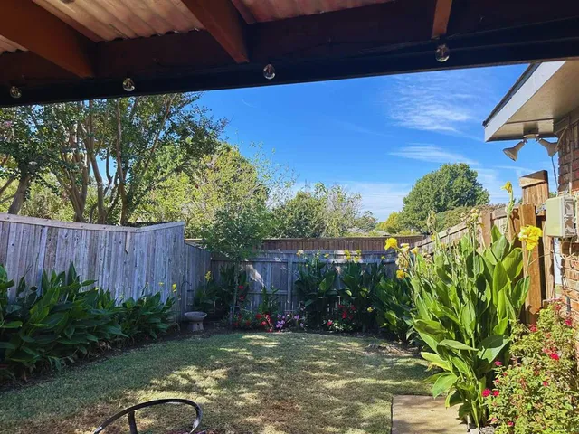 a backyard of a house with lots of green space