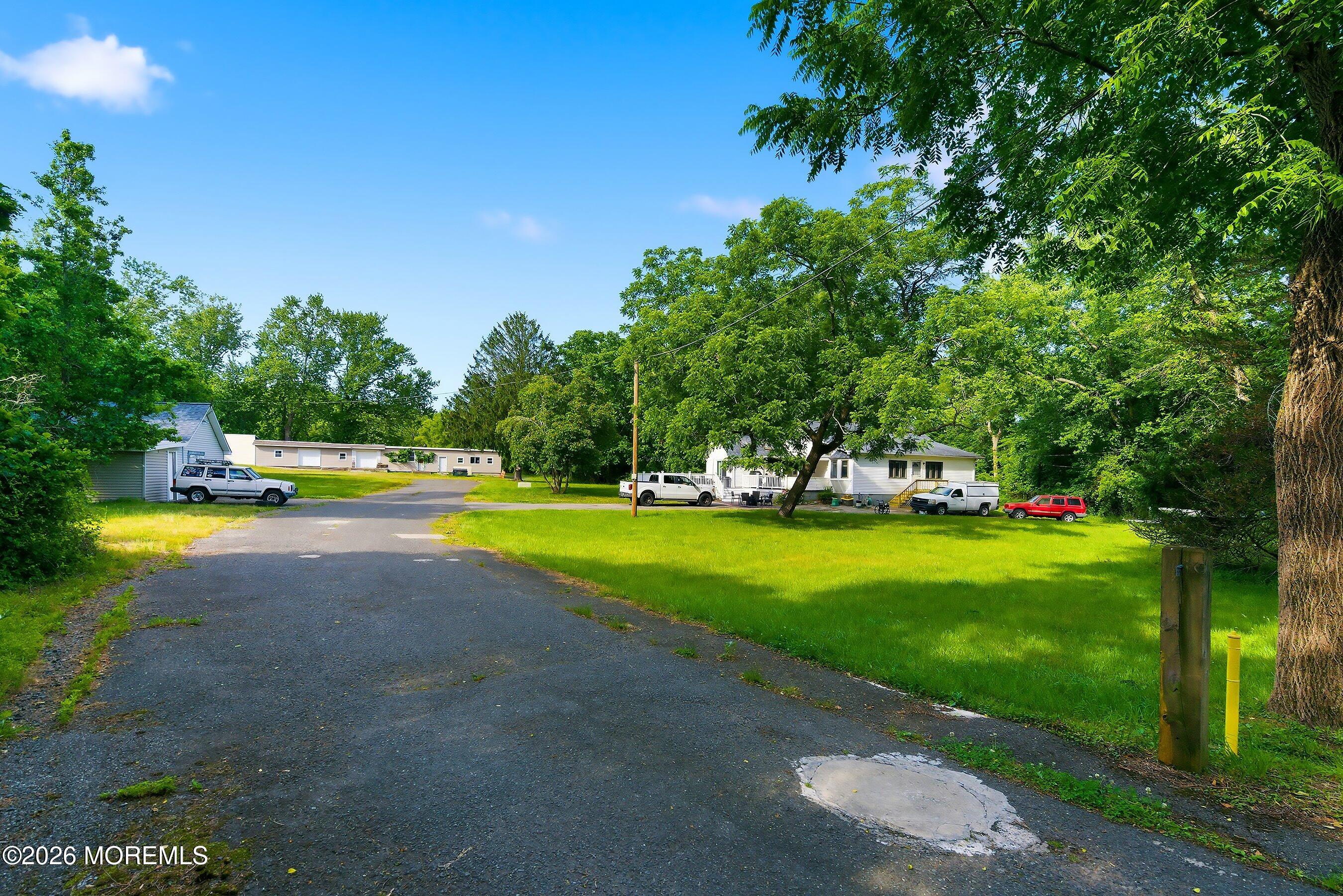 26 Megill Road Farmingdale, NJ 07727 - Photo 6 of 16 a view of a house with a yard