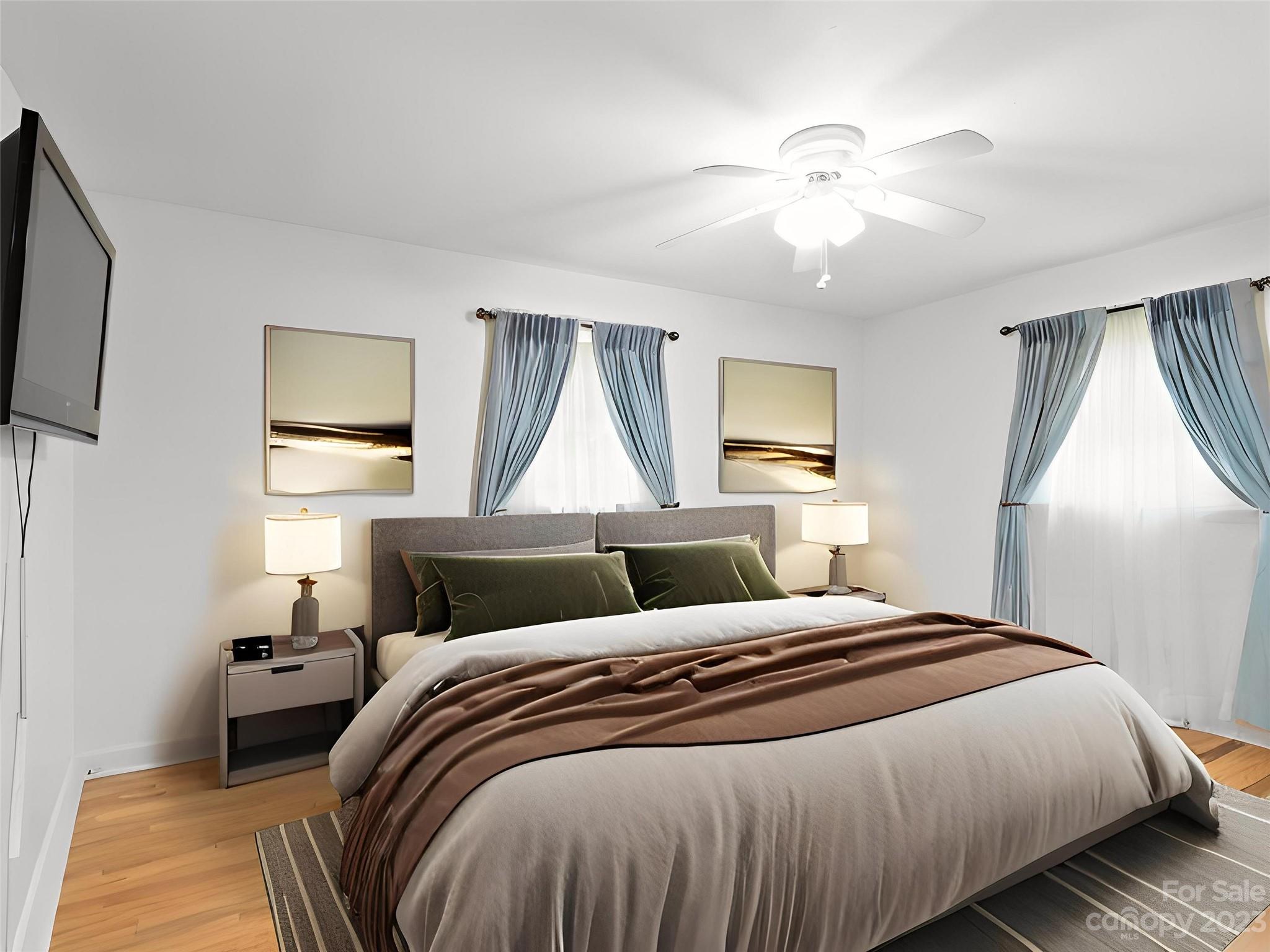 151 Elm Road Blacksburg, SC 29702 - Photo 23 of 35 a bedroom with a bed and a flat screen tv