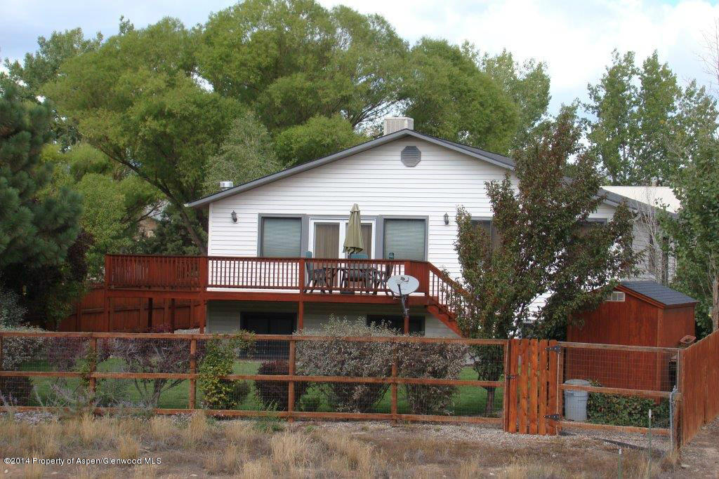 1001 Arnold Court Rifle, CO 81650 - Photo 2 of 39 a view of a house with a garden and plants