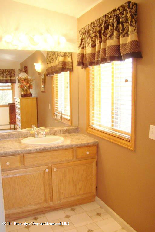1001 Arnold Court Rifle, CO 81650 - Photo 21 of 39 a view of a bathroom with a sink and a large window