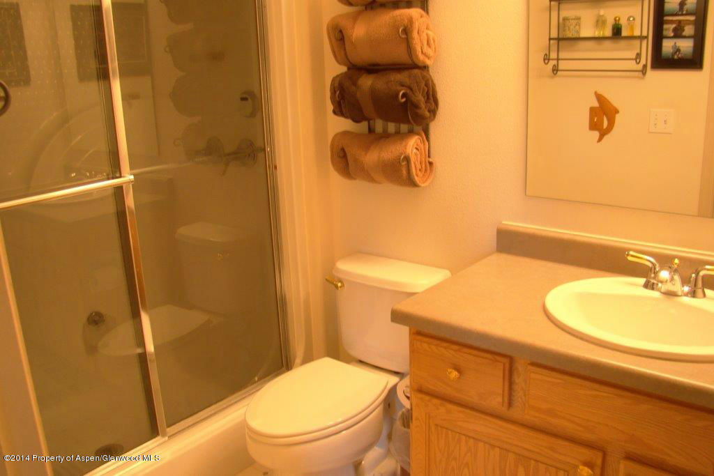 1001 Arnold Court Rifle, CO 81650 - Photo 24 of 39 a bathroom with a granite countertop sink toilet and shower