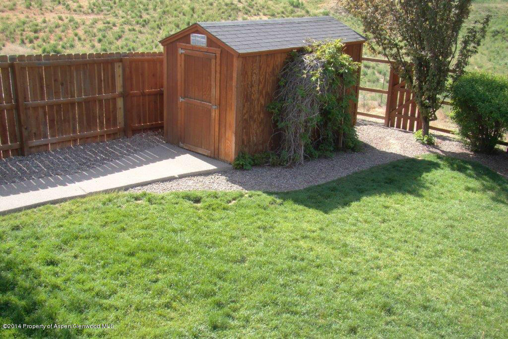 1001 Arnold Court Rifle, CO 81650 - Photo 30 of 39 a view of a backyard with wooden fence