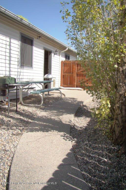1001 Arnold Court Rifle, CO 81650 - Photo 34 of 39 a backyard of a house with table and chairs