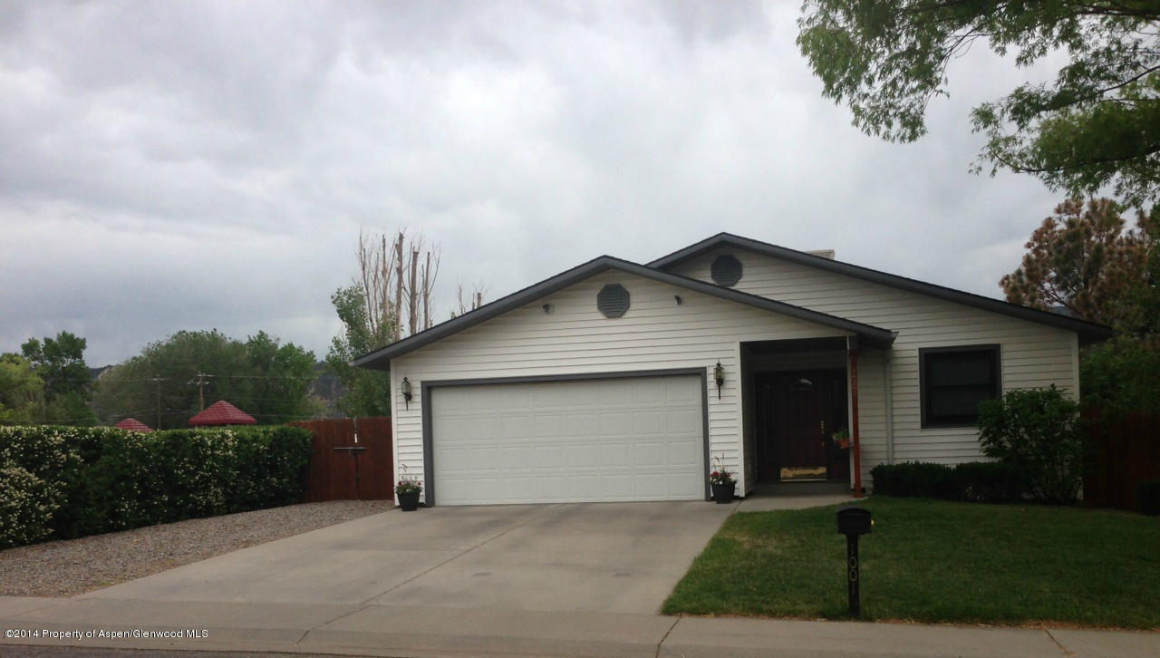 1001 Arnold Court Rifle, CO 81650 - Photo 36 of 39 a front view of a house with a garden and trees
