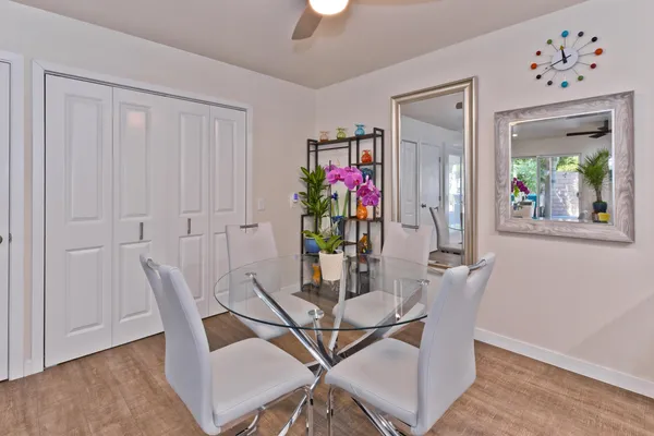 a kitchen with granite countertop a refrigerator sink and cabinets