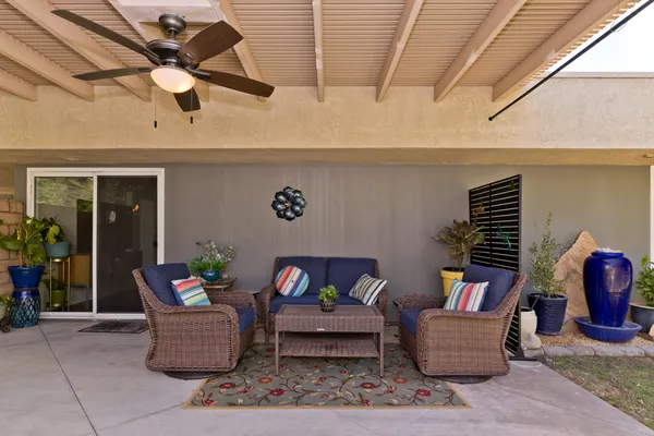 a swimming pool with outdoor seating