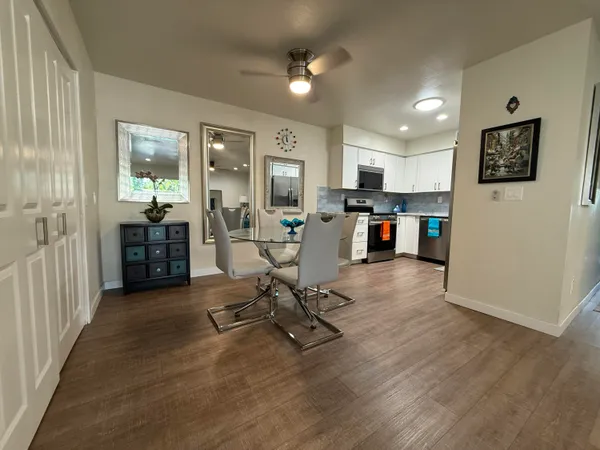 a kitchen with stainless steel appliances granite countertop a stove a sink and a refrigerator