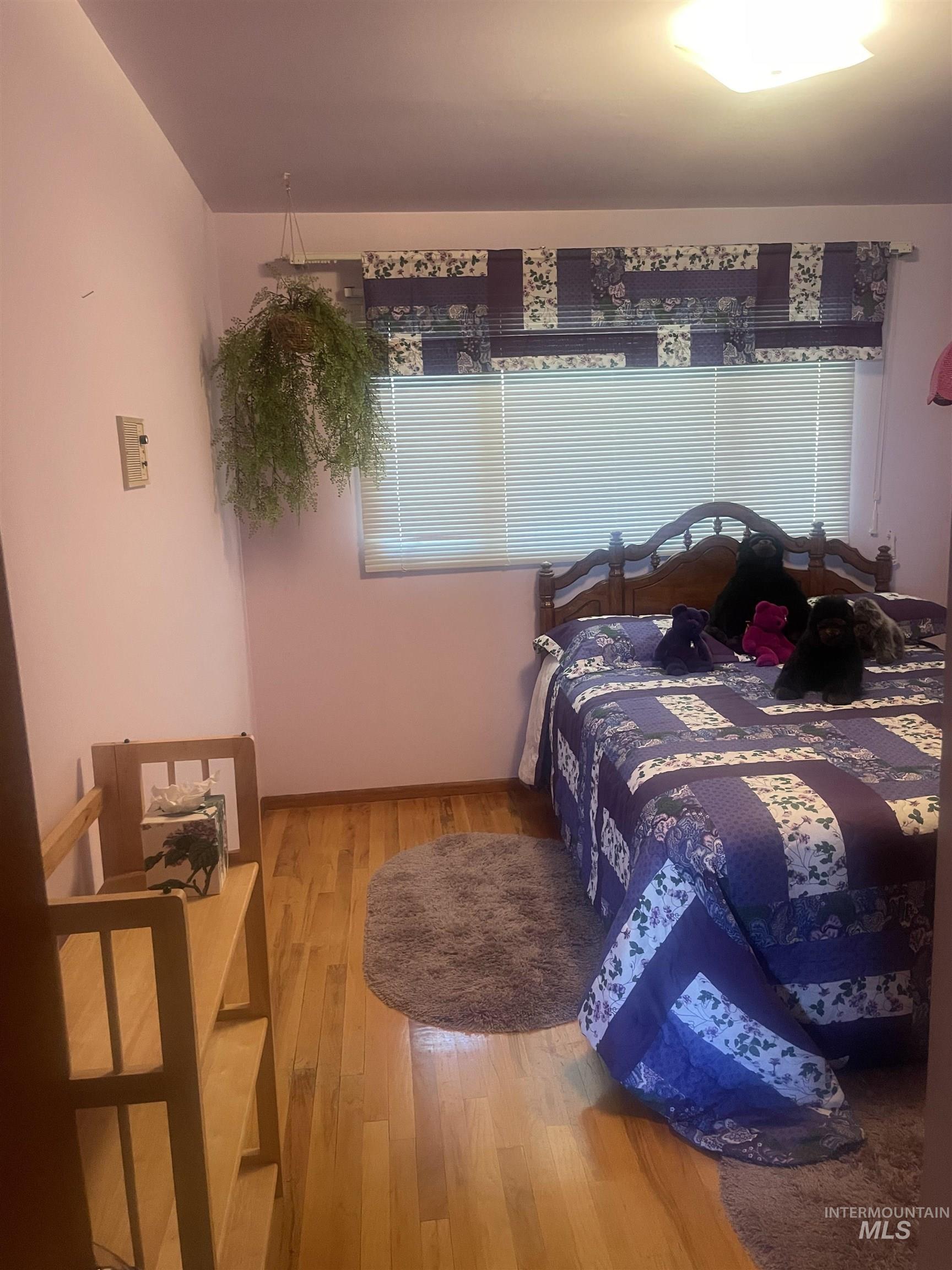 2002 Missman Road Council, ID 83612 - Photo 21 of 38 Bedroom with light wood-style flooring and baseboards