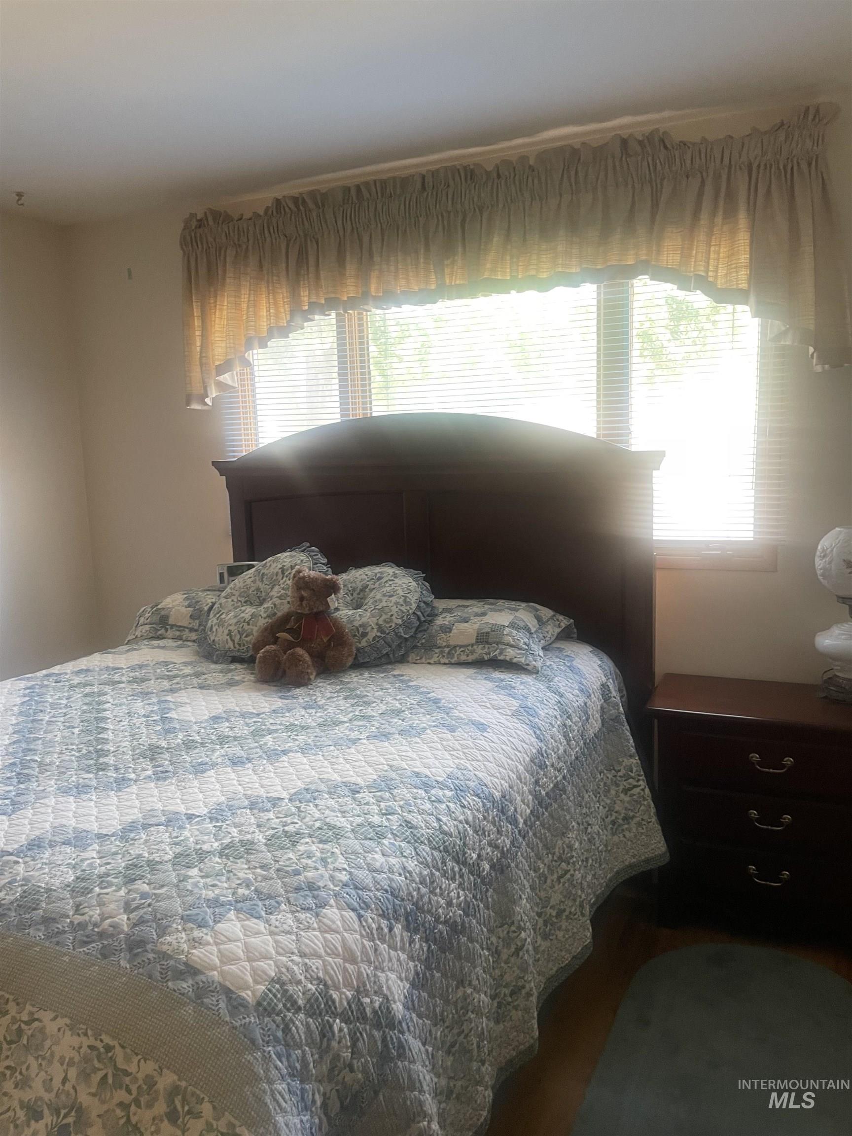 2002 Missman Road Council, ID 83612 - Photo 22 of 38 Bedroom featuring wood finished floors