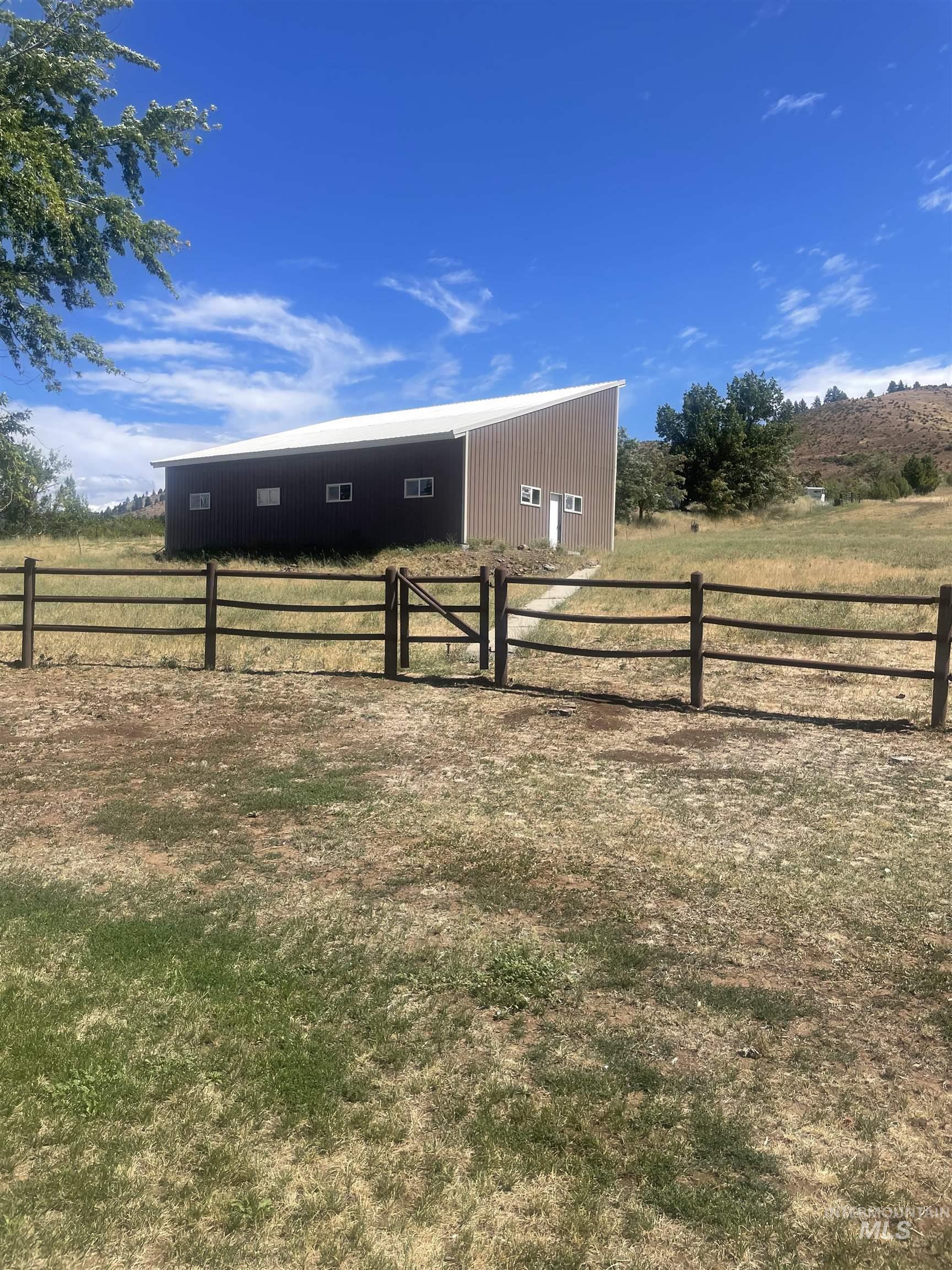 2002 Missman Road Council, ID 83612 - Photo 26 of 38 View of yard featuring an outbuilding, a rural view, and a pole building