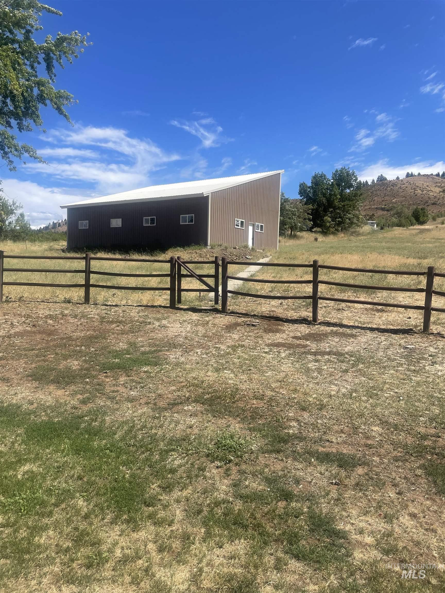 2002 Missman Road Council, ID 83612 - Photo 27 of 38 View of yard featuring an outbuilding and a view of rural / pastoral area