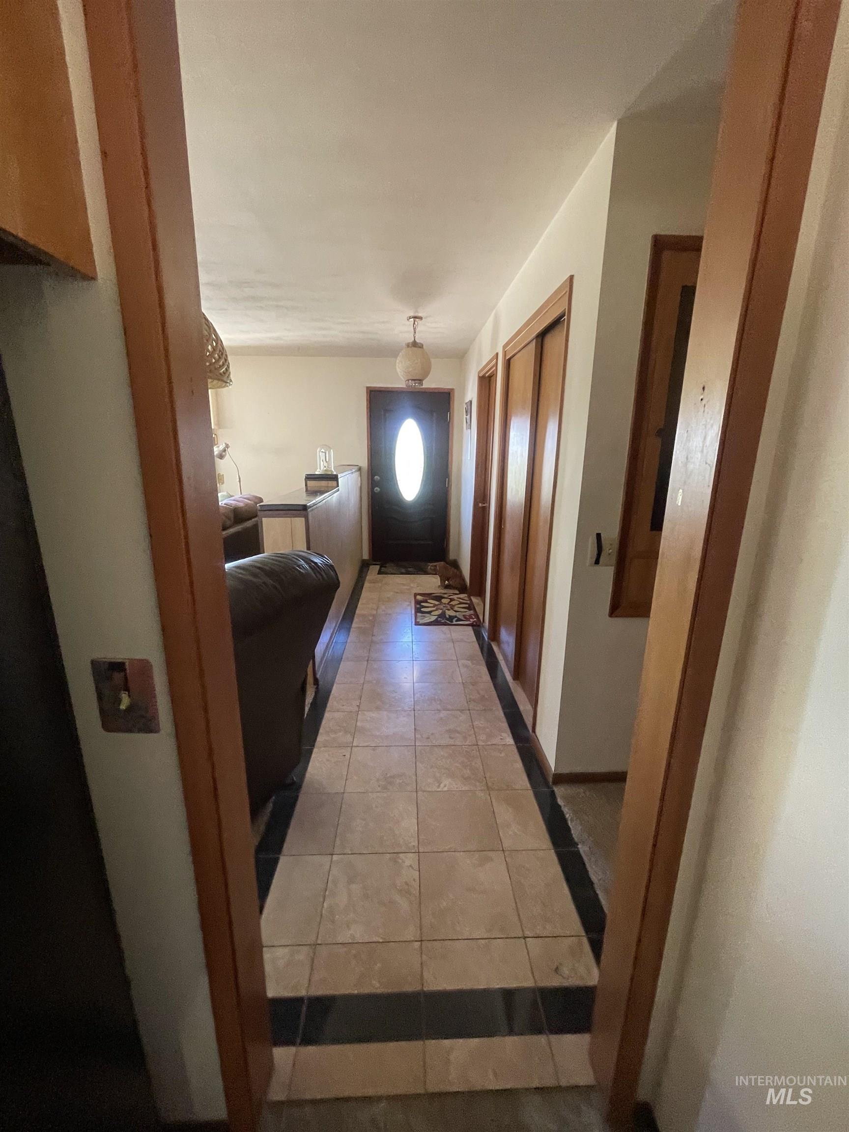 2002 Missman Road Council, ID 83612 - Photo 9 of 38 Corridor featuring light tile patterned floors