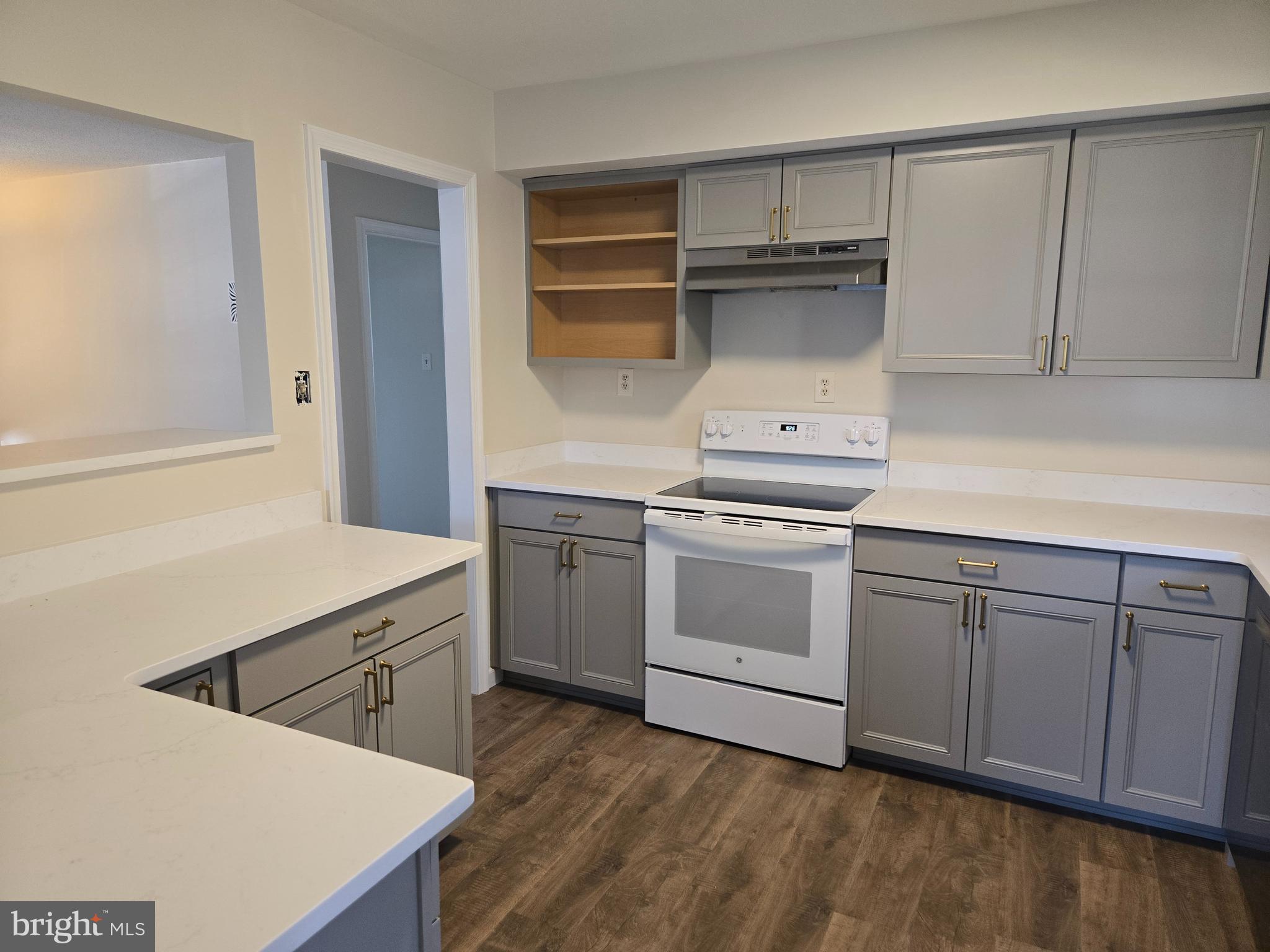 341 South 26th Street, Unit A Purcellville, VA 20132 - Photo 11 of 33 a kitchen with white cabinets and white appliances