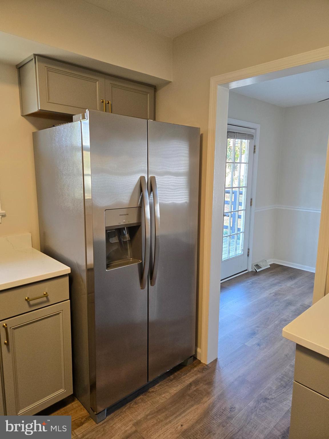 341 South 26th Street, Unit A Purcellville, VA 20132 - Photo 13 of 33 a kitchen with a refrigerator and a wooden floor