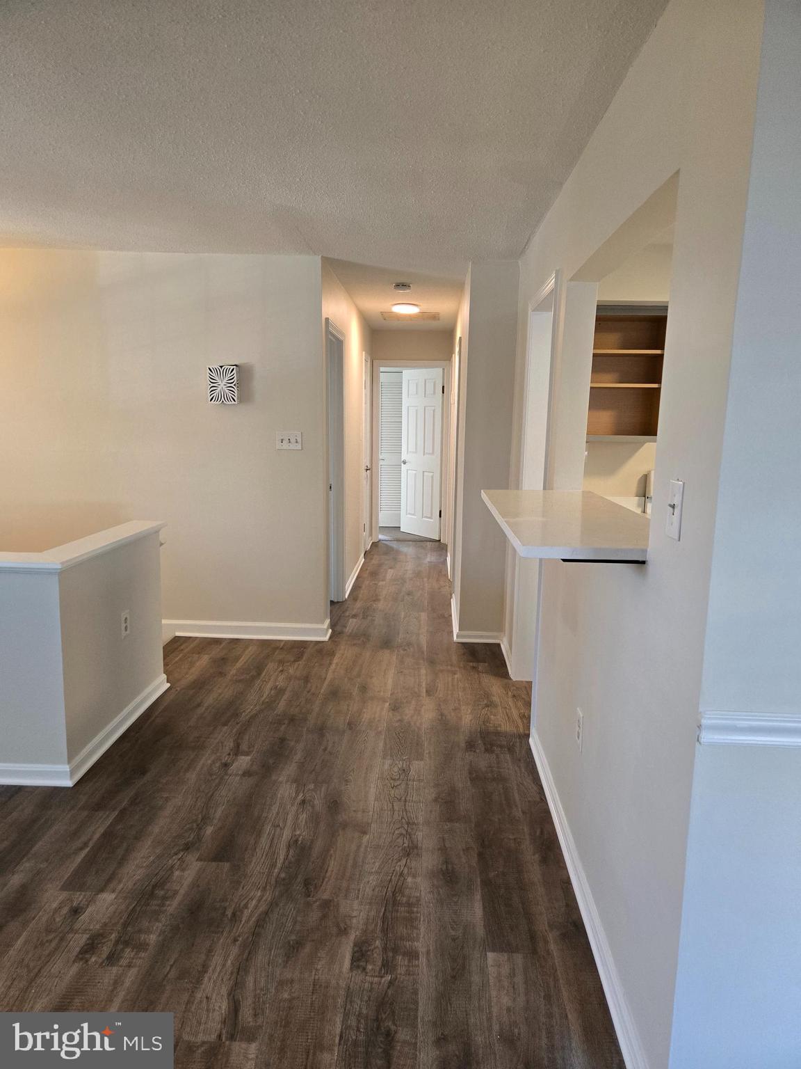 341 South 26th Street, Unit A Purcellville, VA 20132 - Photo 18 of 33 a view of a hallway with wooden floor and staircase
