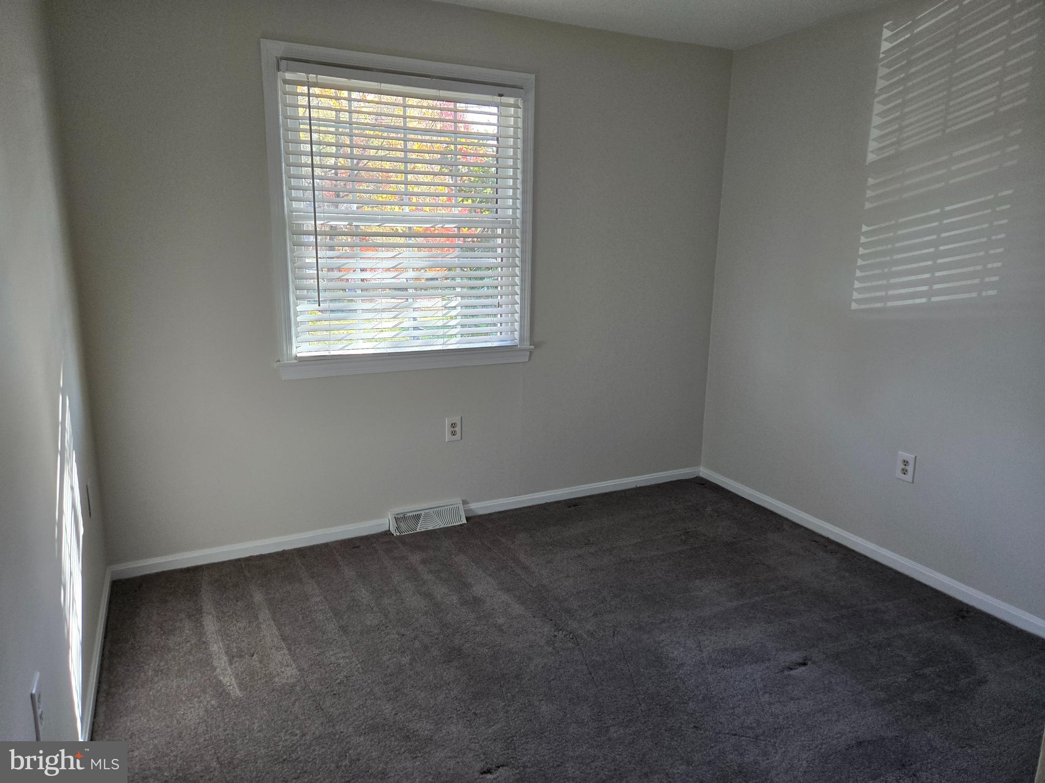 341 South 26th Street, Unit A Purcellville, VA 20132 - Photo 19 of 33 an empty room with a window