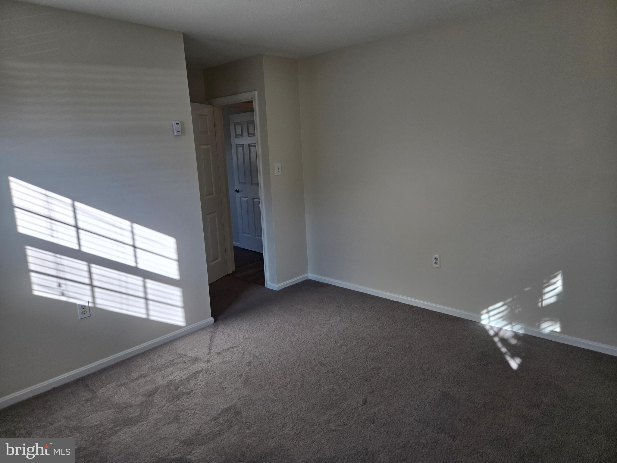 341 South 26th Street, Unit A Purcellville, VA 20132 - Photo 24 of 33 an empty room with windows
